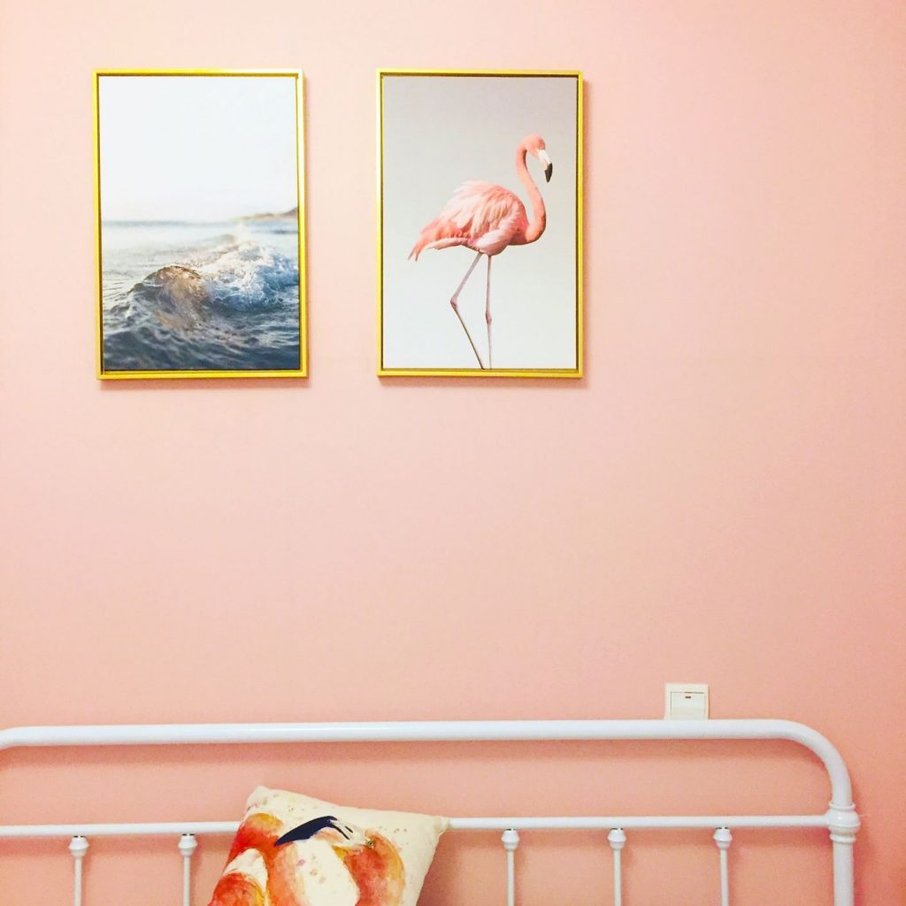Flamingo and ocean prints on coral wall
